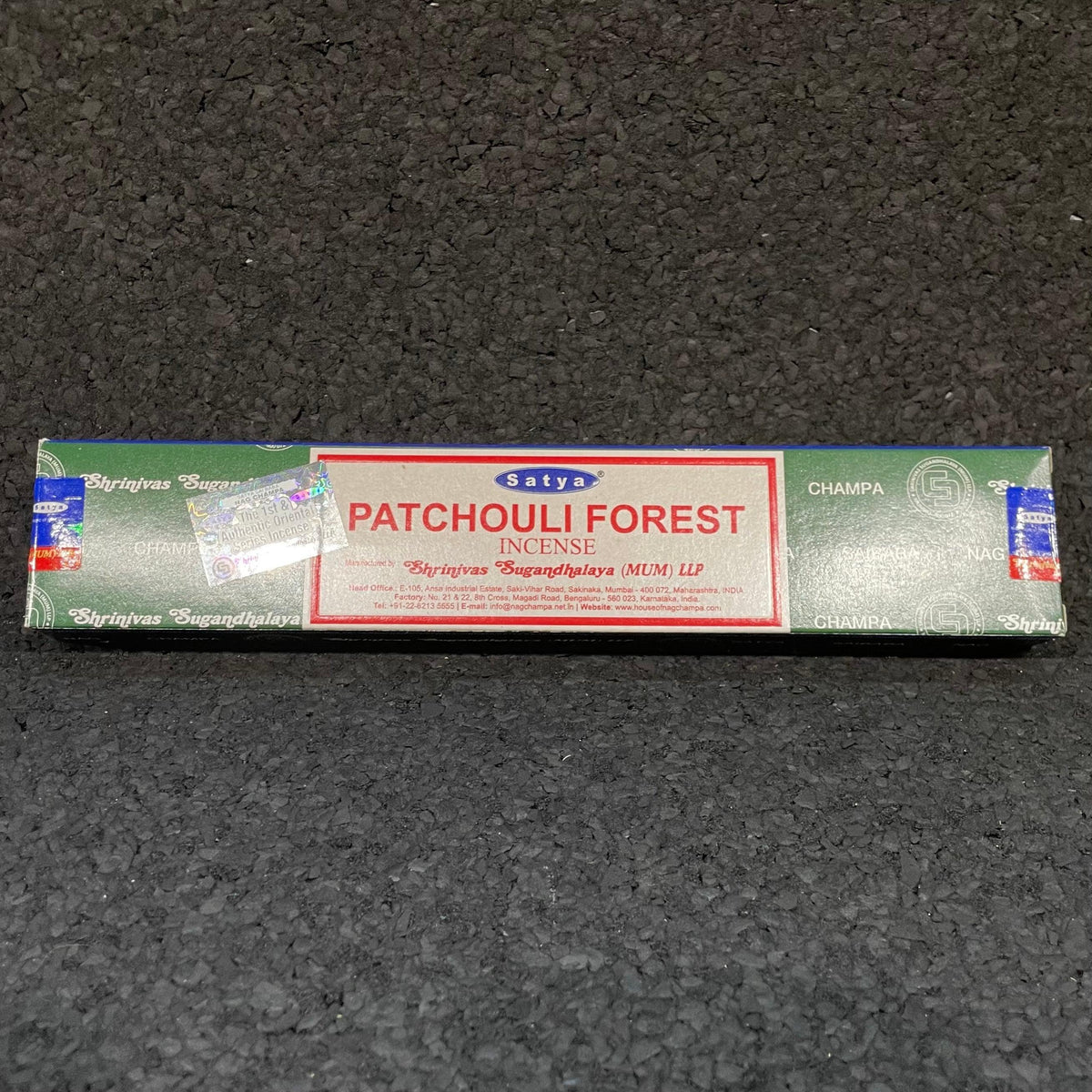 Satya Patchouli Forest incense box on textured black surface