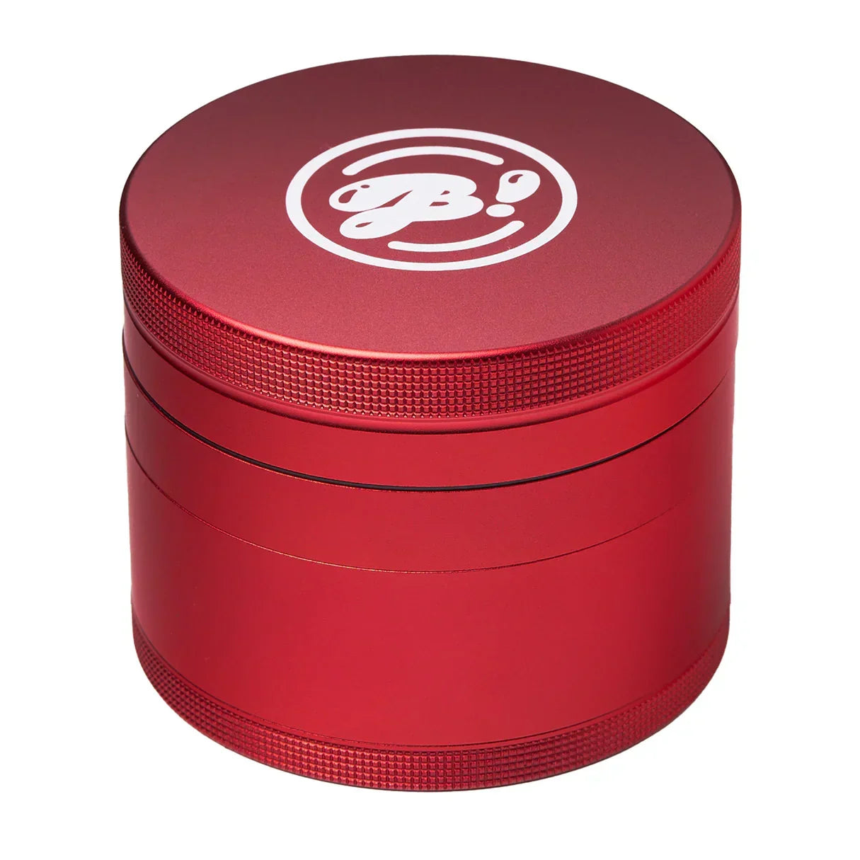 Red metal herb grinder with textured grip and white logo on lid, isolated on white background