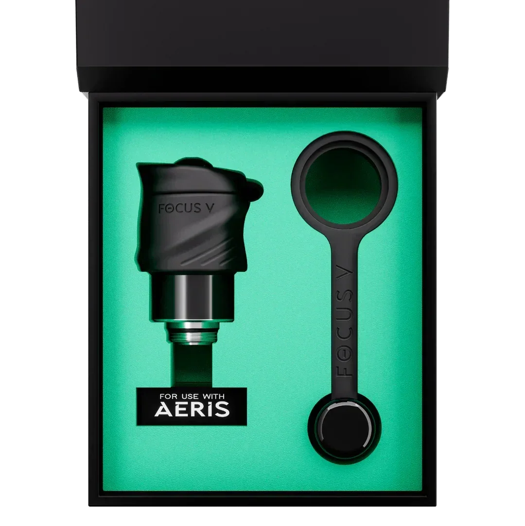 Focus V Aeris vaporizer accessory kit with black nozzle and tool in a green-lined box