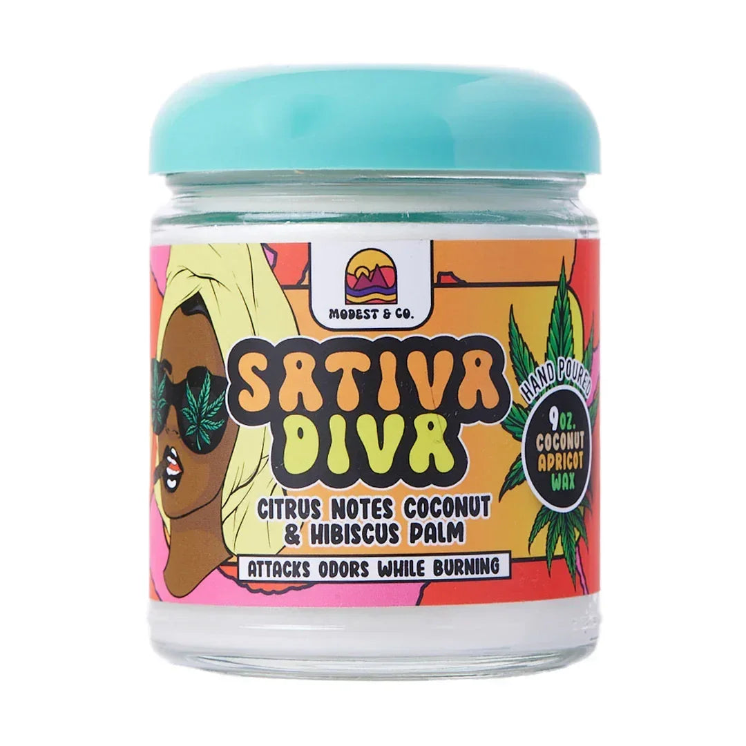 Sativa Diva odor-eliminating candle jar with colorful label, coconut apricot wax, citrus scent.