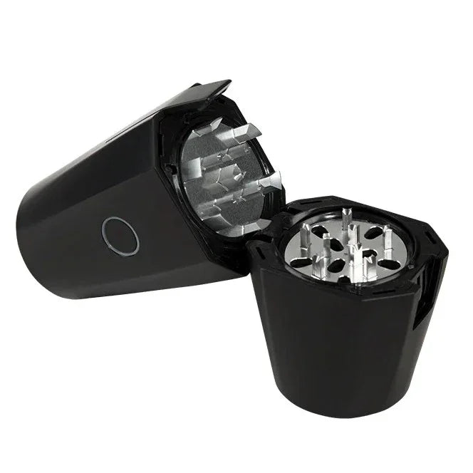 Black metal herb grinder with sharp teeth, open to show grinding chamber