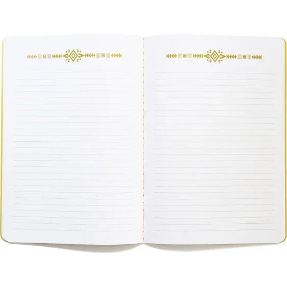 Open lined notebook with decorative gold accents on white pages