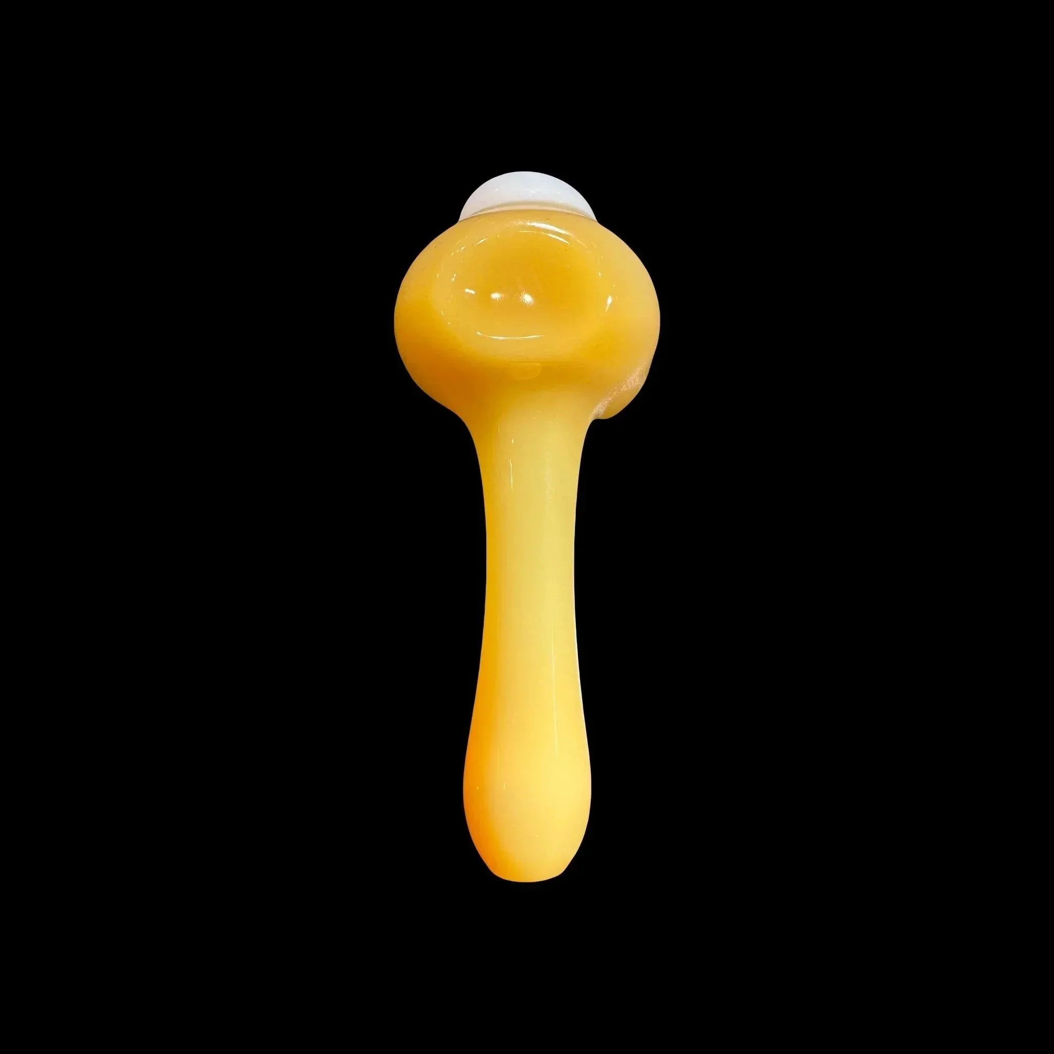 Yellow glass hand pipe with round bowl and smooth finish on black background