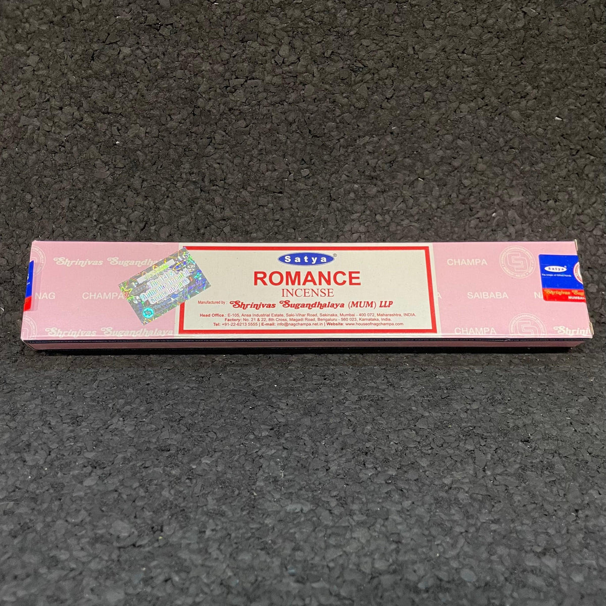 Satya Romance incense sticks pink box on dark textured background
