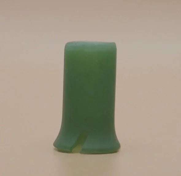 Green silicone mouthpiece accessory for smoking devices on neutral background