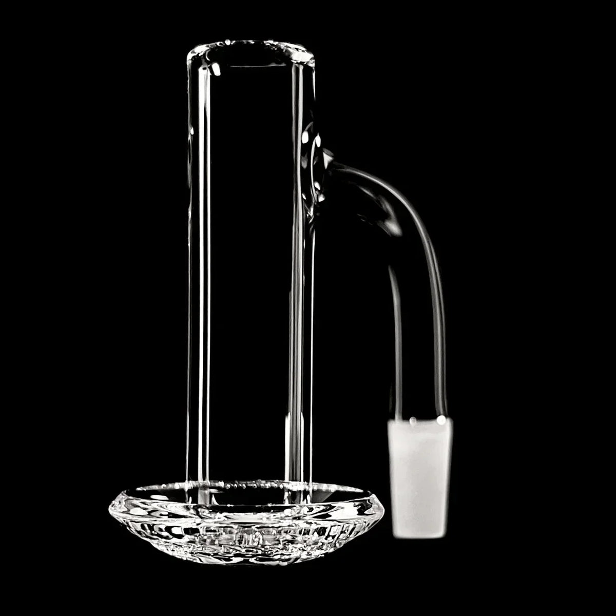 Clear glass quartz banger with textured base for dab rig on black background