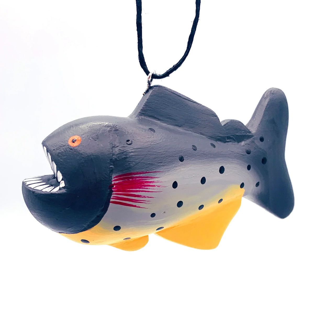 Hand-painted fish-shaped ornament with sharp teeth, hanging on a black string.