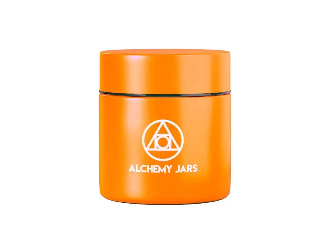 Bright orange Alchemy Jars airtight storage container with white geometric logo on front