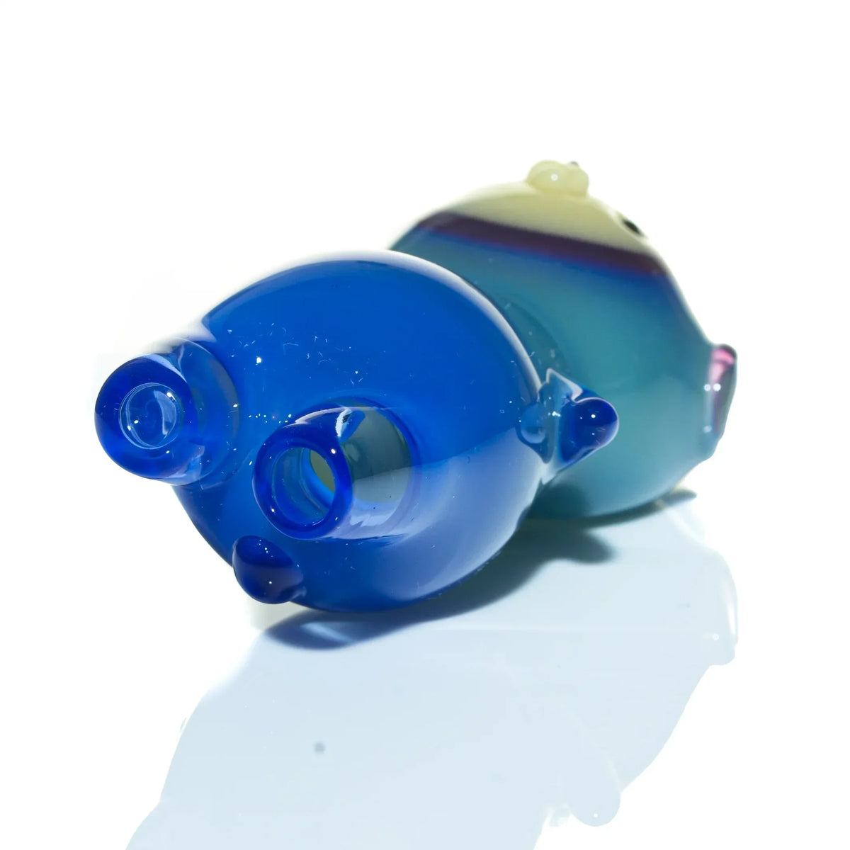 Aquarius blue gradient glass hand pipe with dual mouthpiece on reflective surface