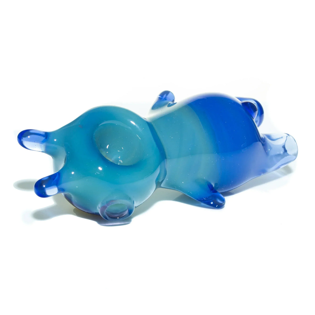 Blue glass spoon pipe with gradient fade and rounded animal-inspired design on white background