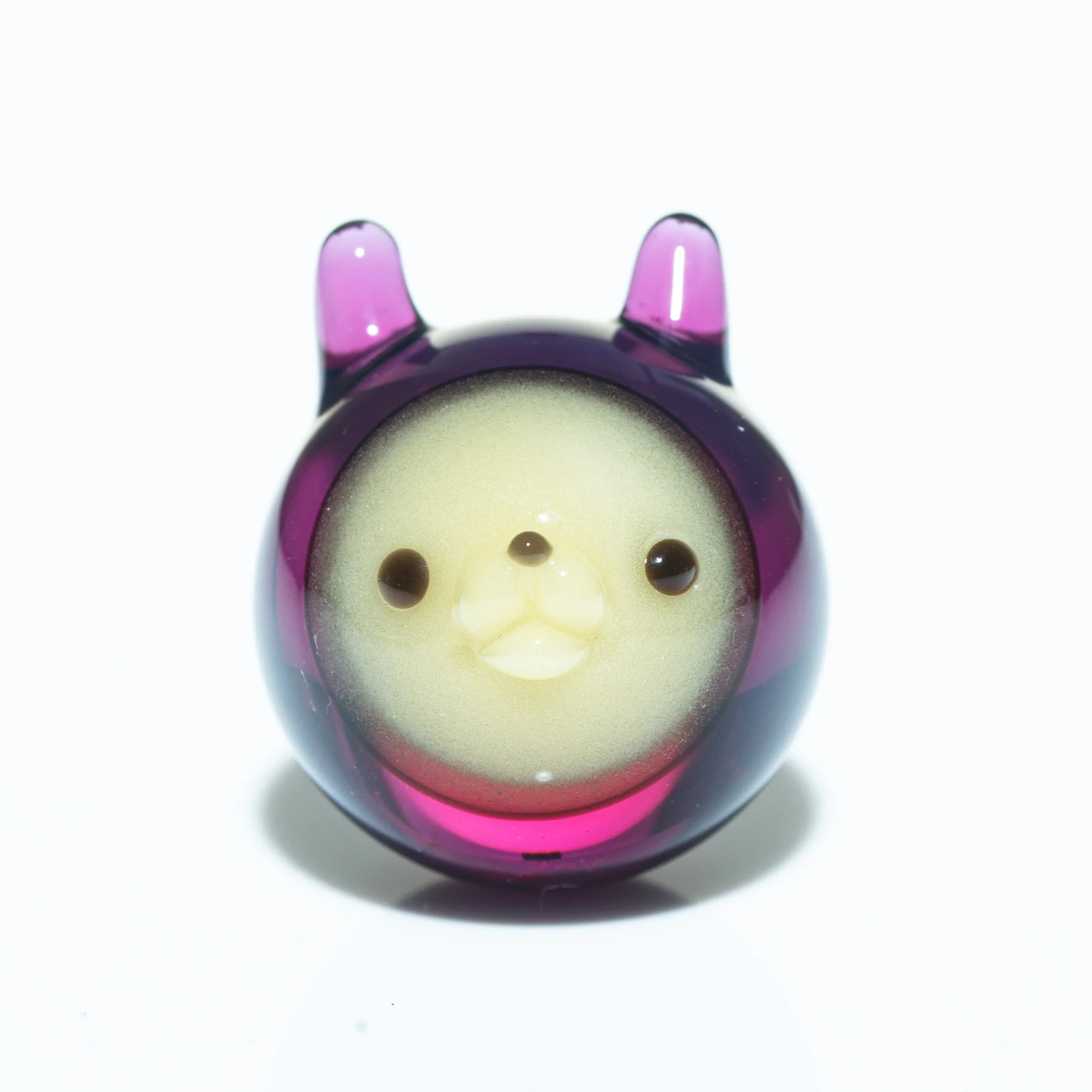 Gold and amethyst glass carb cap shaped like a cute animal with round face and ears