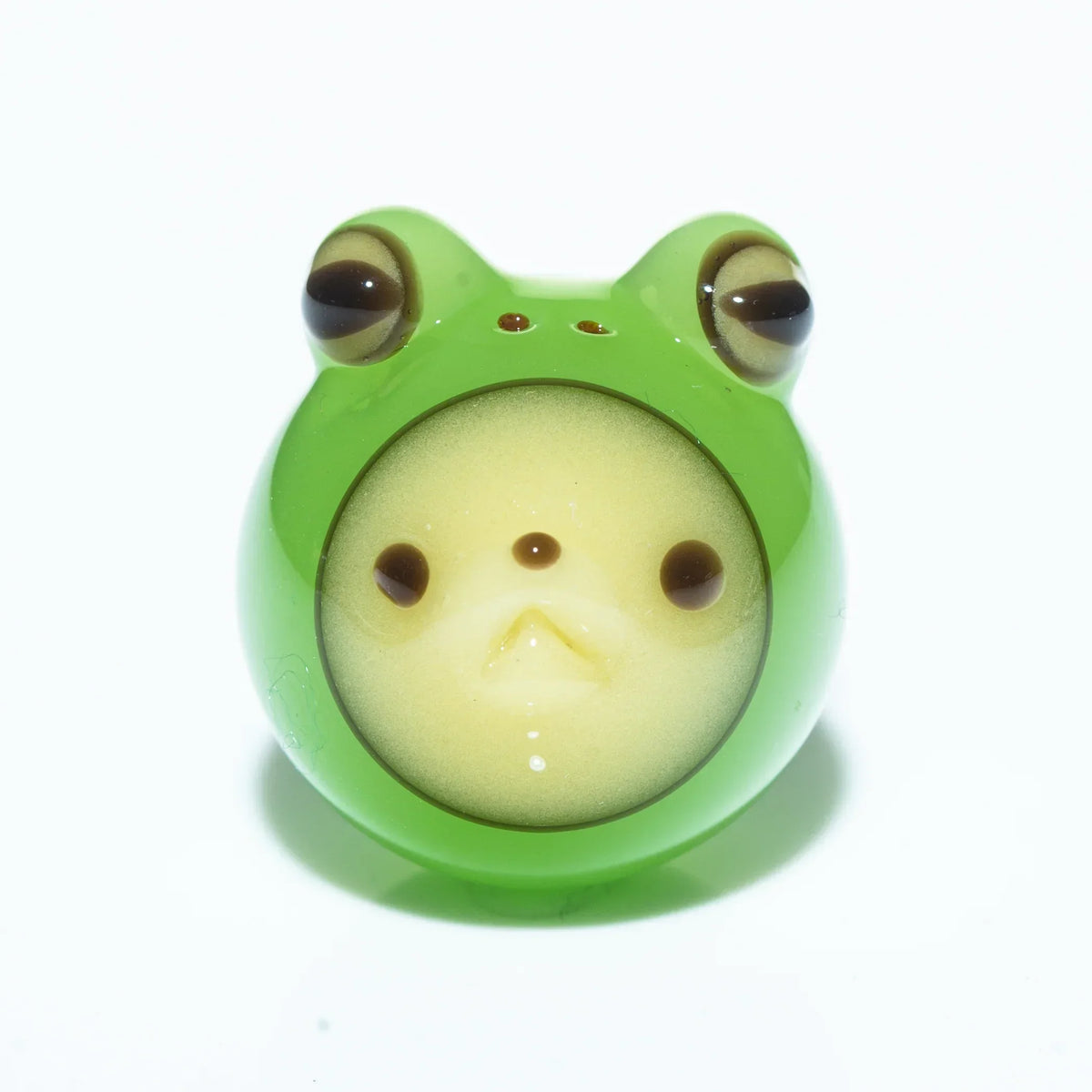 Green glass marble with cute frog face design, collectible smoking accessory