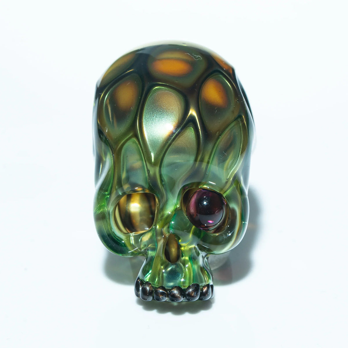 Glass skull pendant with honeycomb pattern and multicolor details on white background