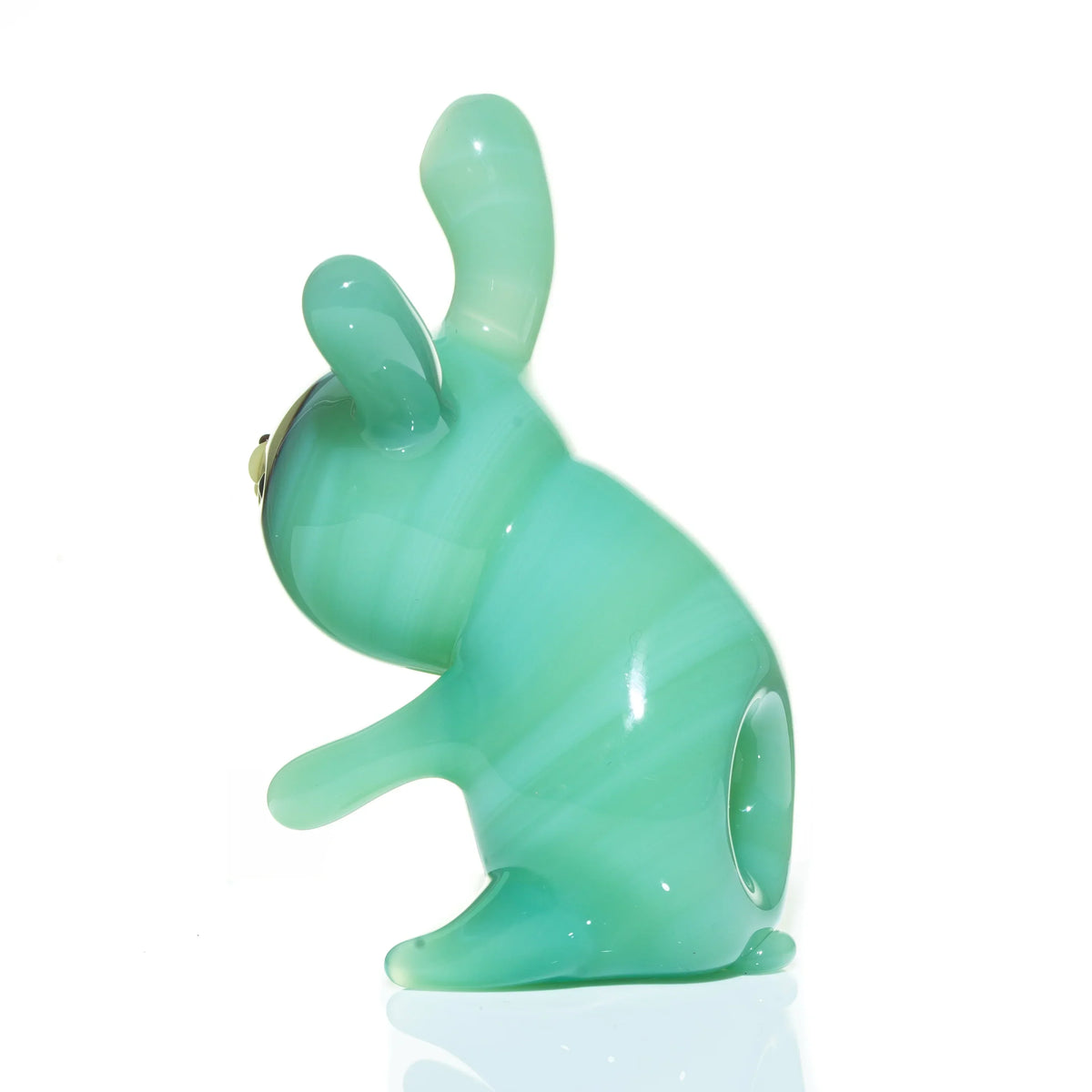 Mint green glass animal-shaped hand pipe with upright ears and smooth finish