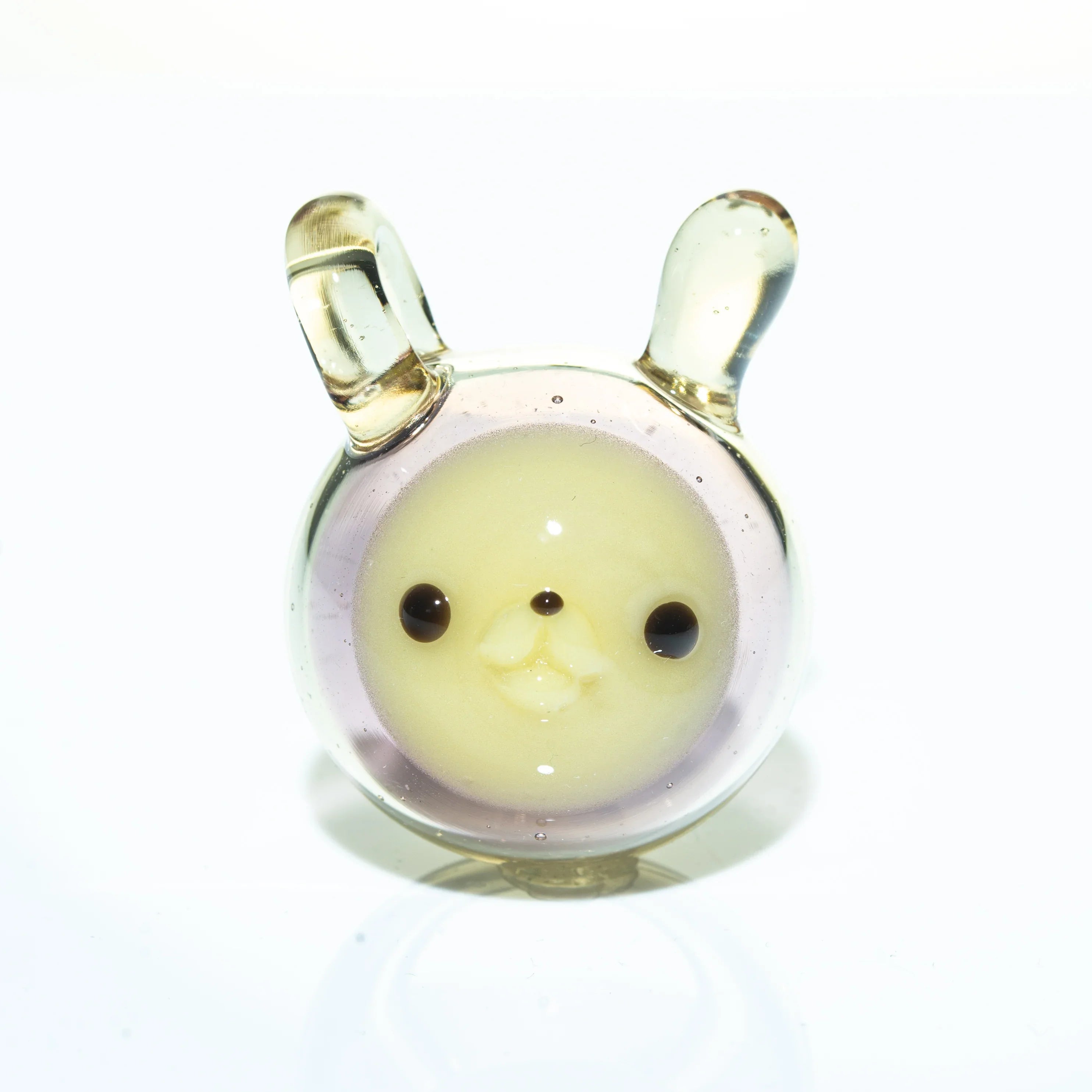 Handmade glass pendant shaped like a cute animal face with ears, clear and light yellow color