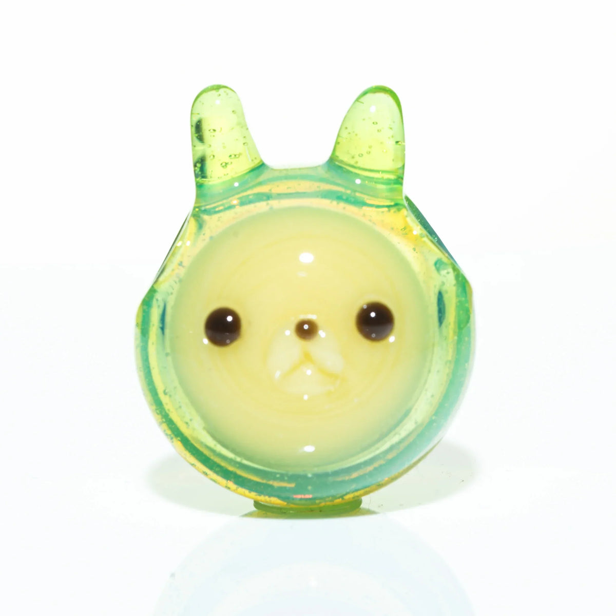 Handcrafted glass pendant with animal face design in yellow and green colors