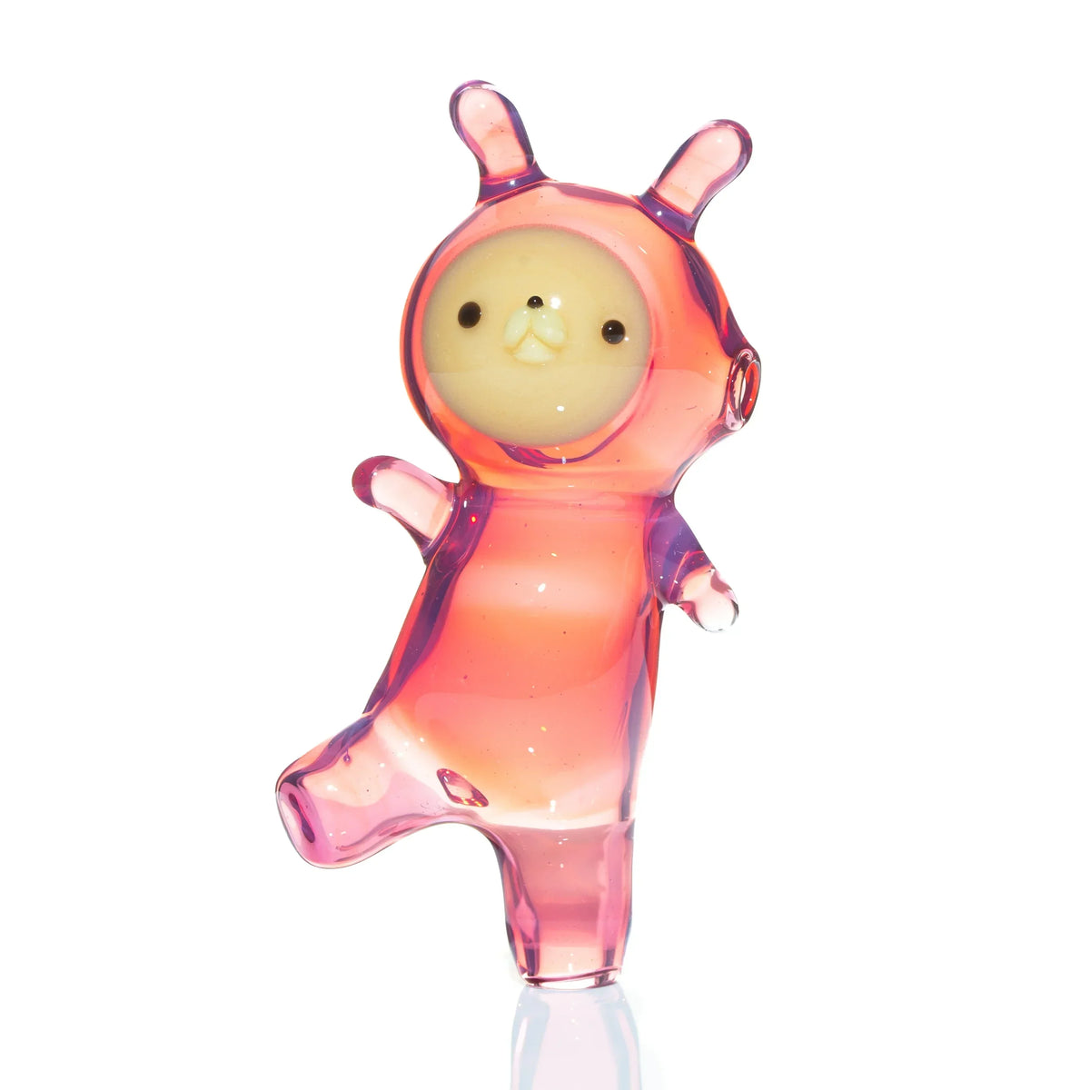 Pink glass animal-shaped carb cap with cute face and raised arms, photographed on white background