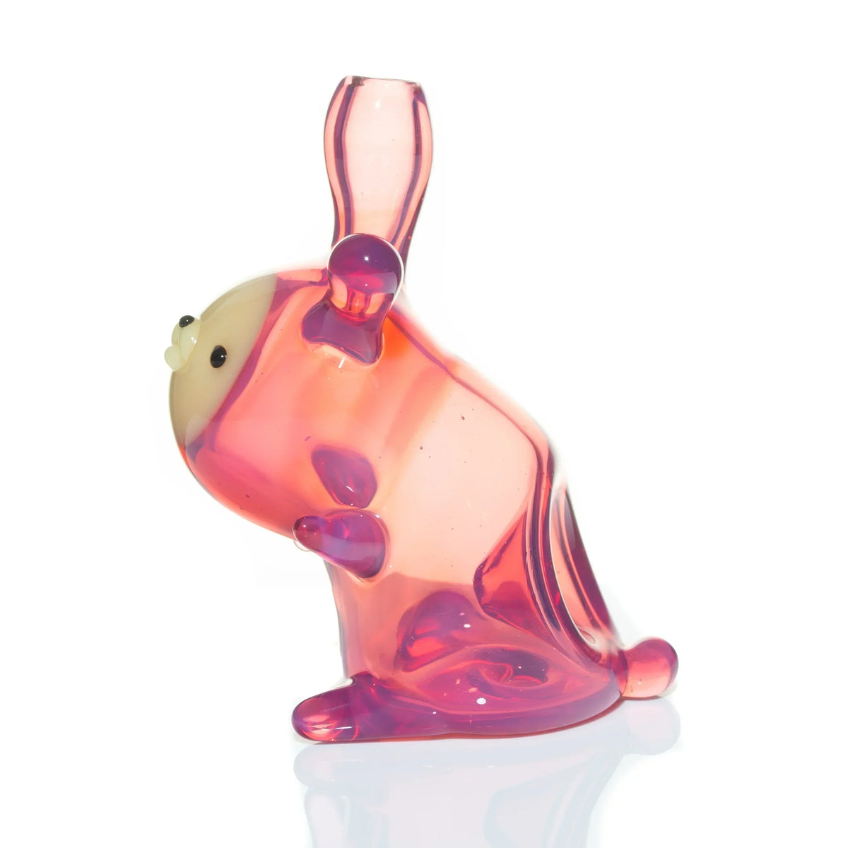 Teal magenta glass animal pipe with transparent body and upright bunny design