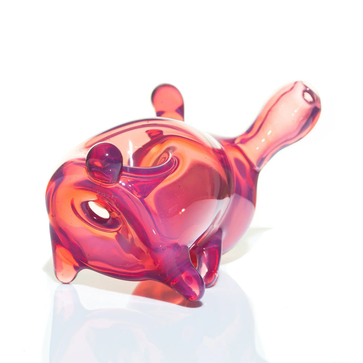 Telemagenta glass hand pipe shaped like a sitting animal, glossy finish, on white background