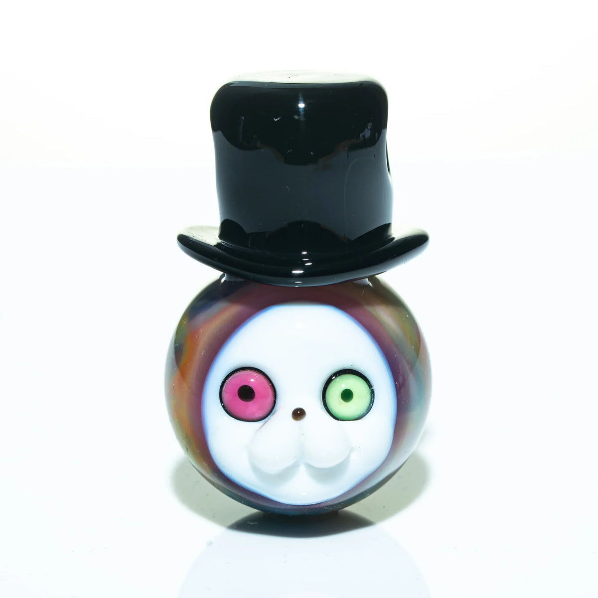 Colorful glass pendant with a cartoon face, mismatched eyes, and black top hat design
