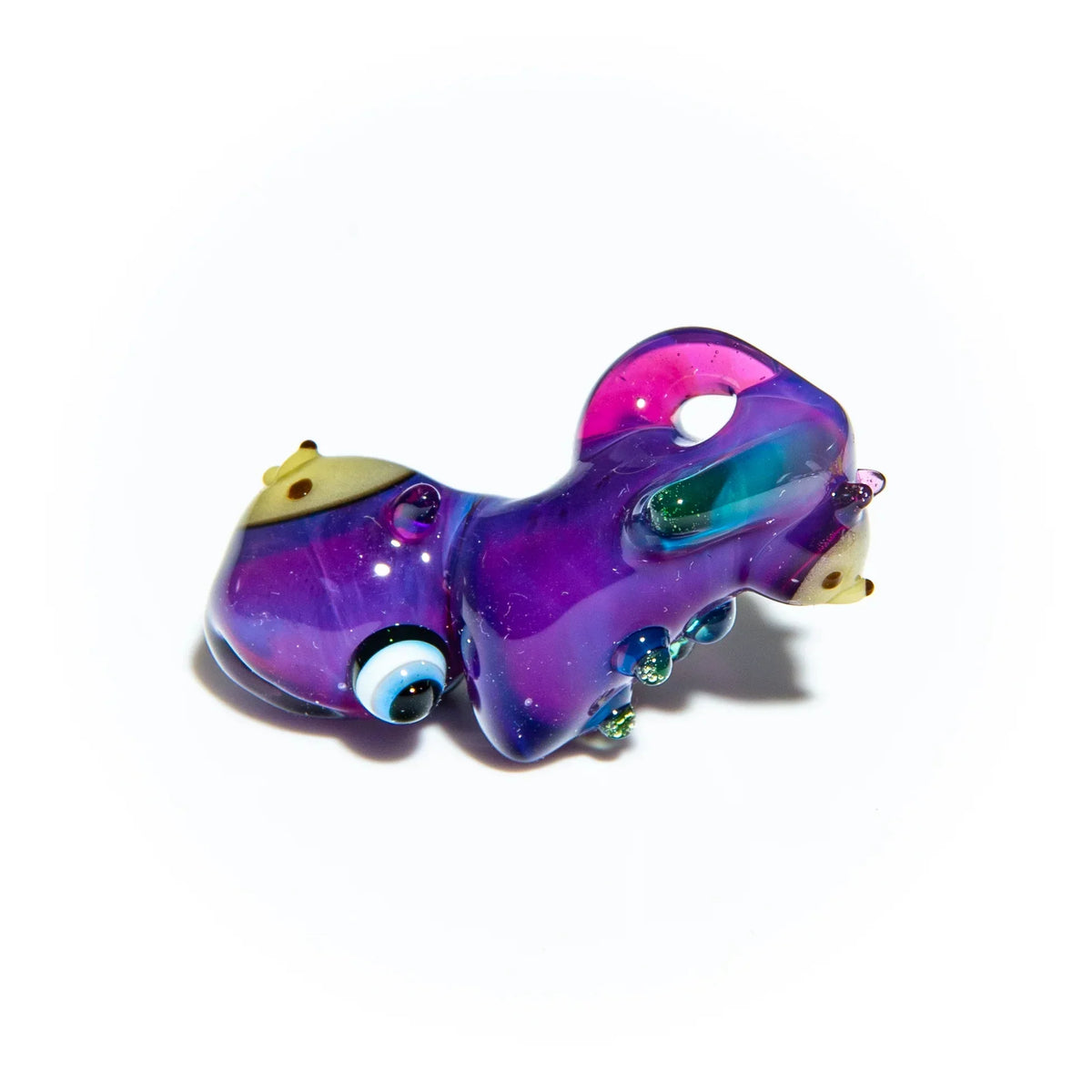 Colorful glass pipe shaped like a purple squid with detailed eyes on white background