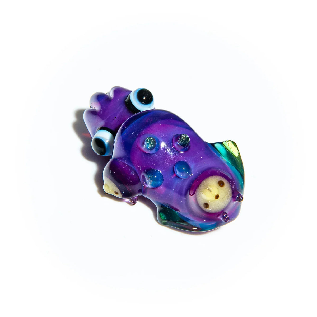 Purple glass squid pipe with blue accents and a detailed face on a white background
