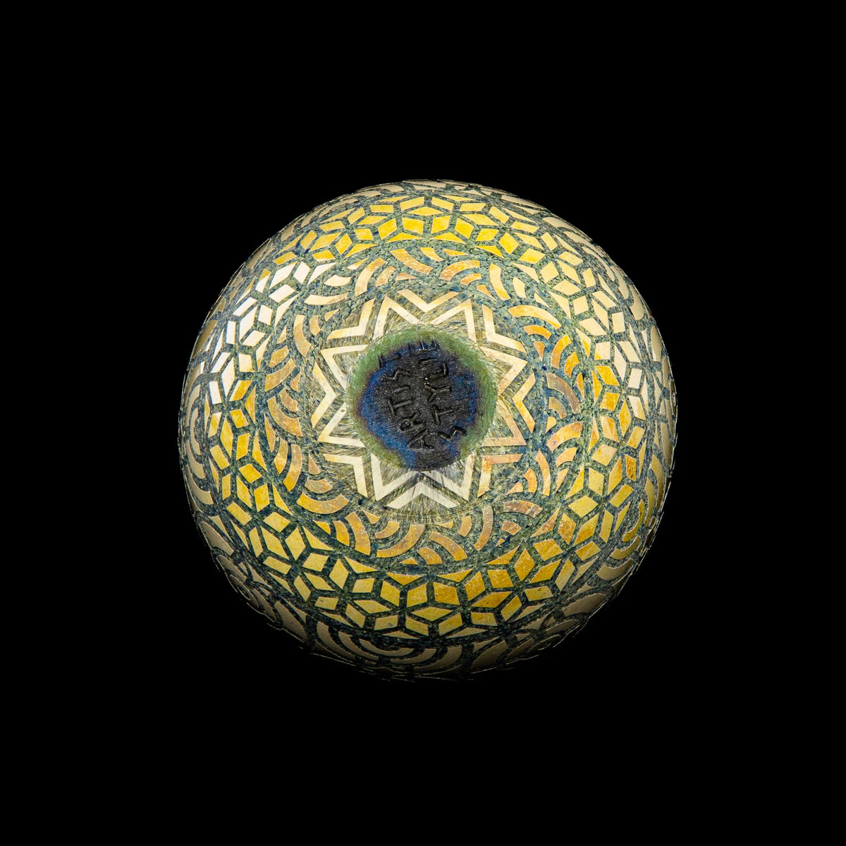 Geometric 60mm marble with intricate yellow and blue mosaic pattern on black background