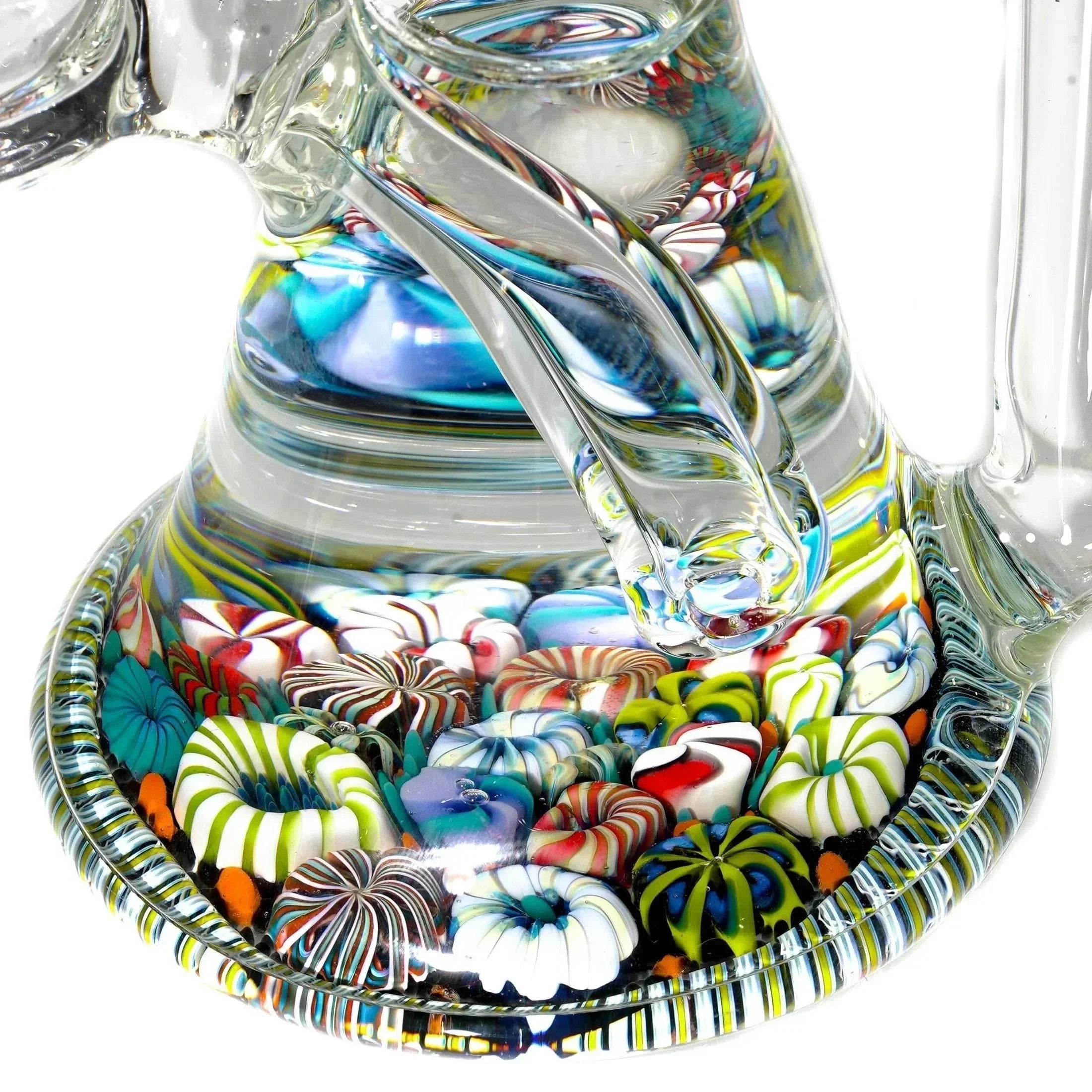 Close-up of artistic glass water pipe base with colorful, intricate millefiori patterns
