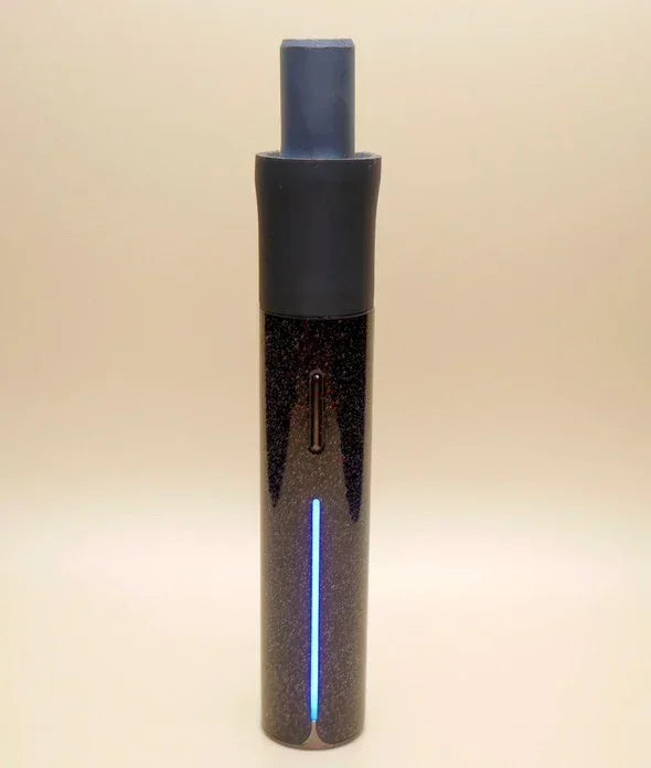 Sleek black dry herb vaporizer with LED indicator and matte mouthpiece on neutral background