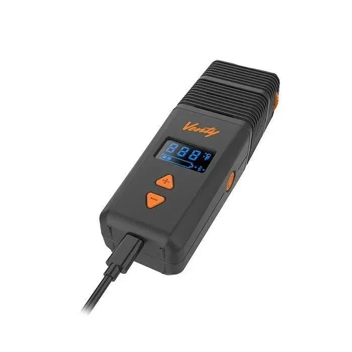 Portable digital vaporizer with LCD screen and temperature controls, charging via USB