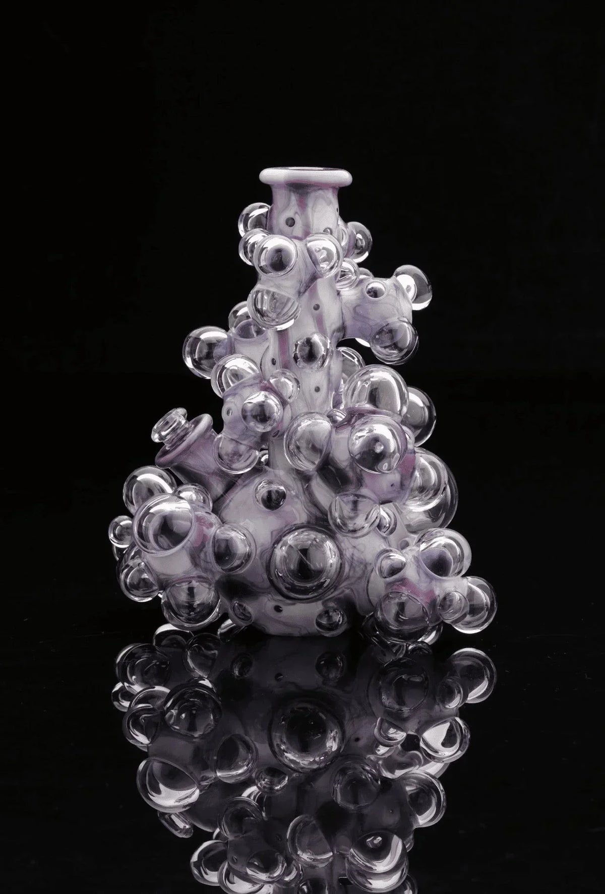 Heady glass water pipe with bubble accents, artistic purple and clear design on black background