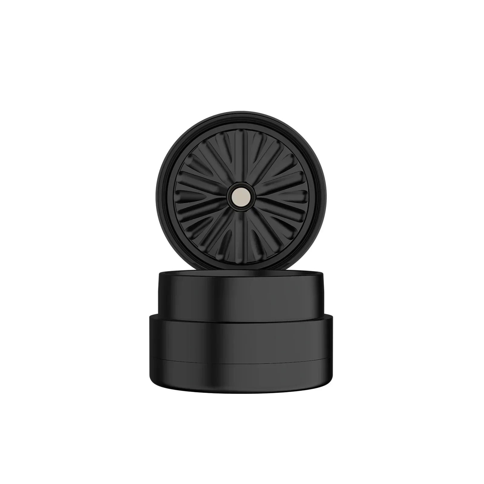 Black herb grinder with textured lid and magnetic center, isolated on white background