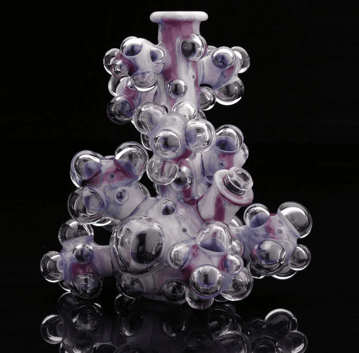 Heady glass water pipe with clear bubble accents and purple swirls on a black background