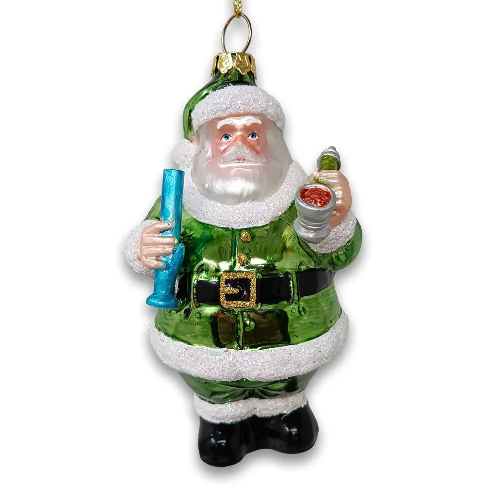 Green Santa ornament holding a blue glass piece and bowl, festive holiday decor