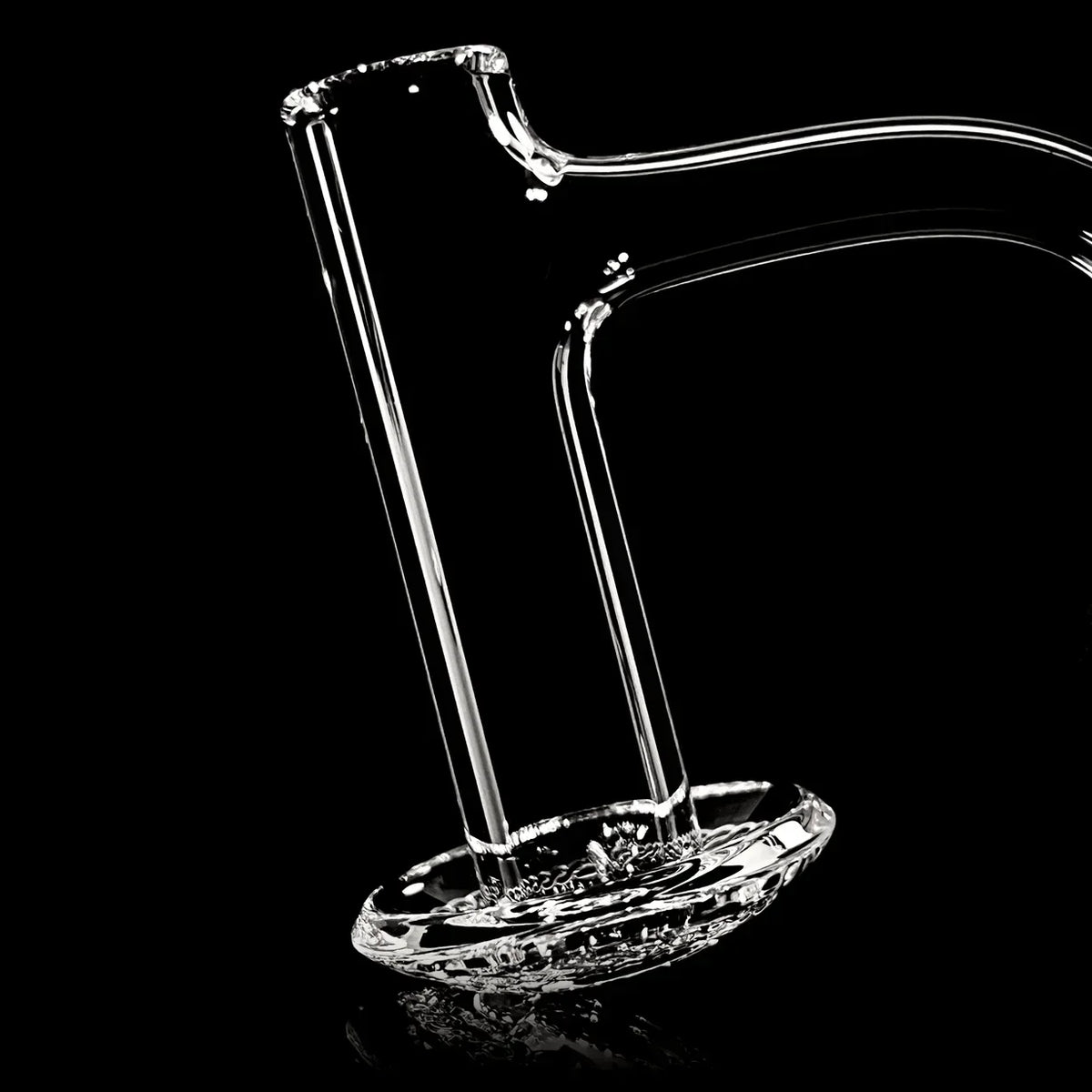 Clear glass water pipe component with disc perc on black background