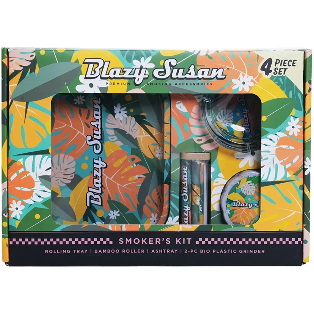 Blazy Susan 4-piece floral smoker's kit with rolling tray, grinder, roller, and ashtray in colorful packaging.