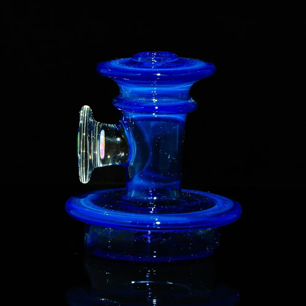 Blue glass Peak attachment accessory with iridescent accent against black background