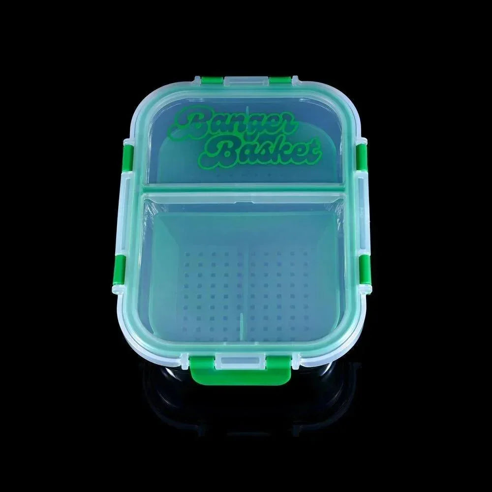 Green plastic Banger Basket storage container with perforated divider, on black background