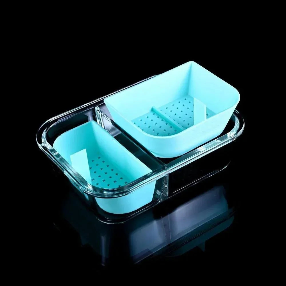 Teal silicone and glass banger cleaning basket with draining holes, displayed on black background