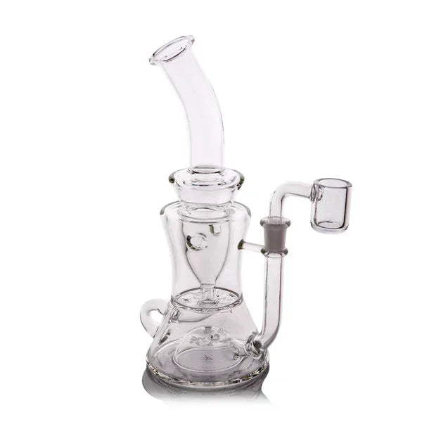 Clear glass recycler rig with angled mouthpiece and quartz banger on white background