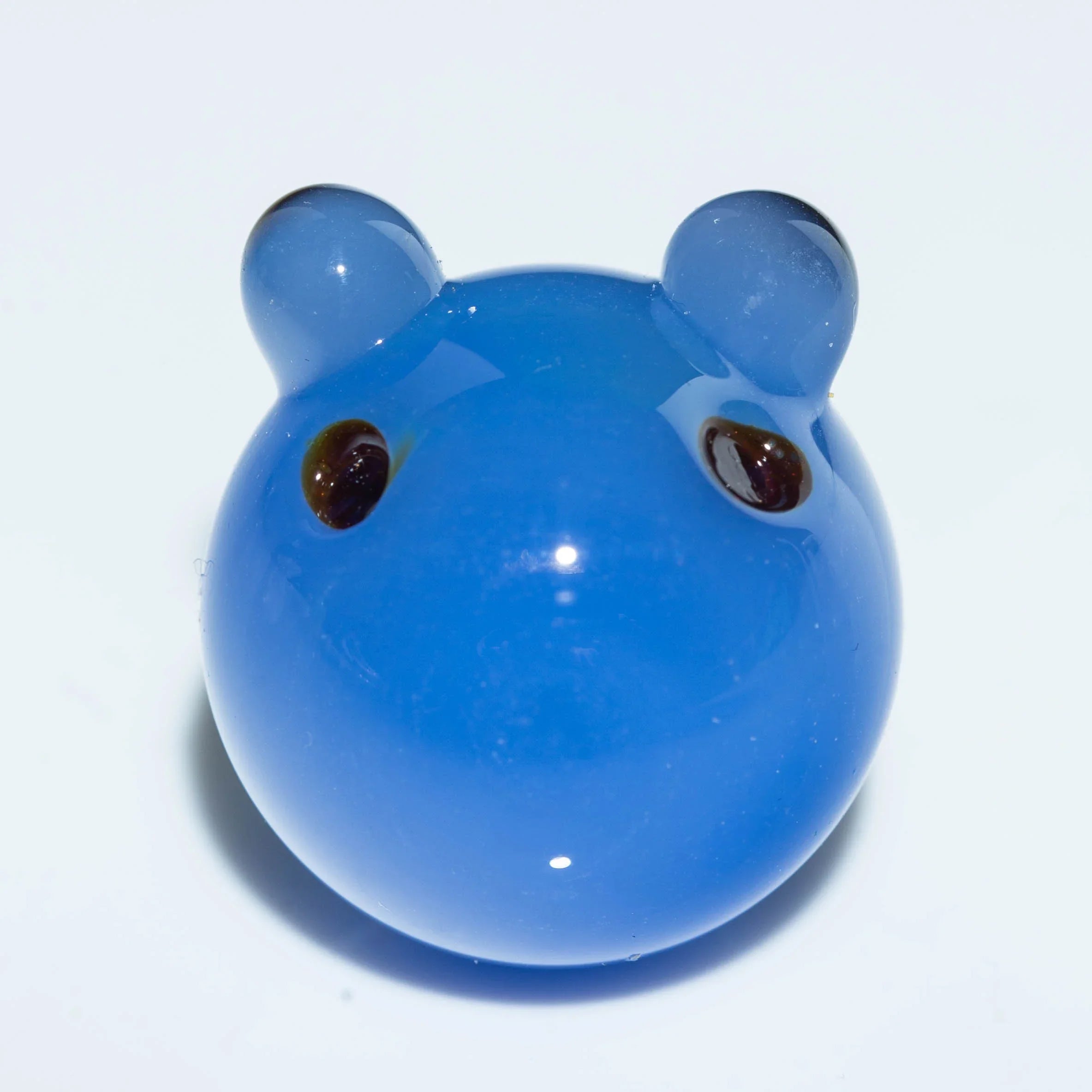 Blue glass carb cap shaped like a bear head with ears and eyes, for dab rigs or bongs