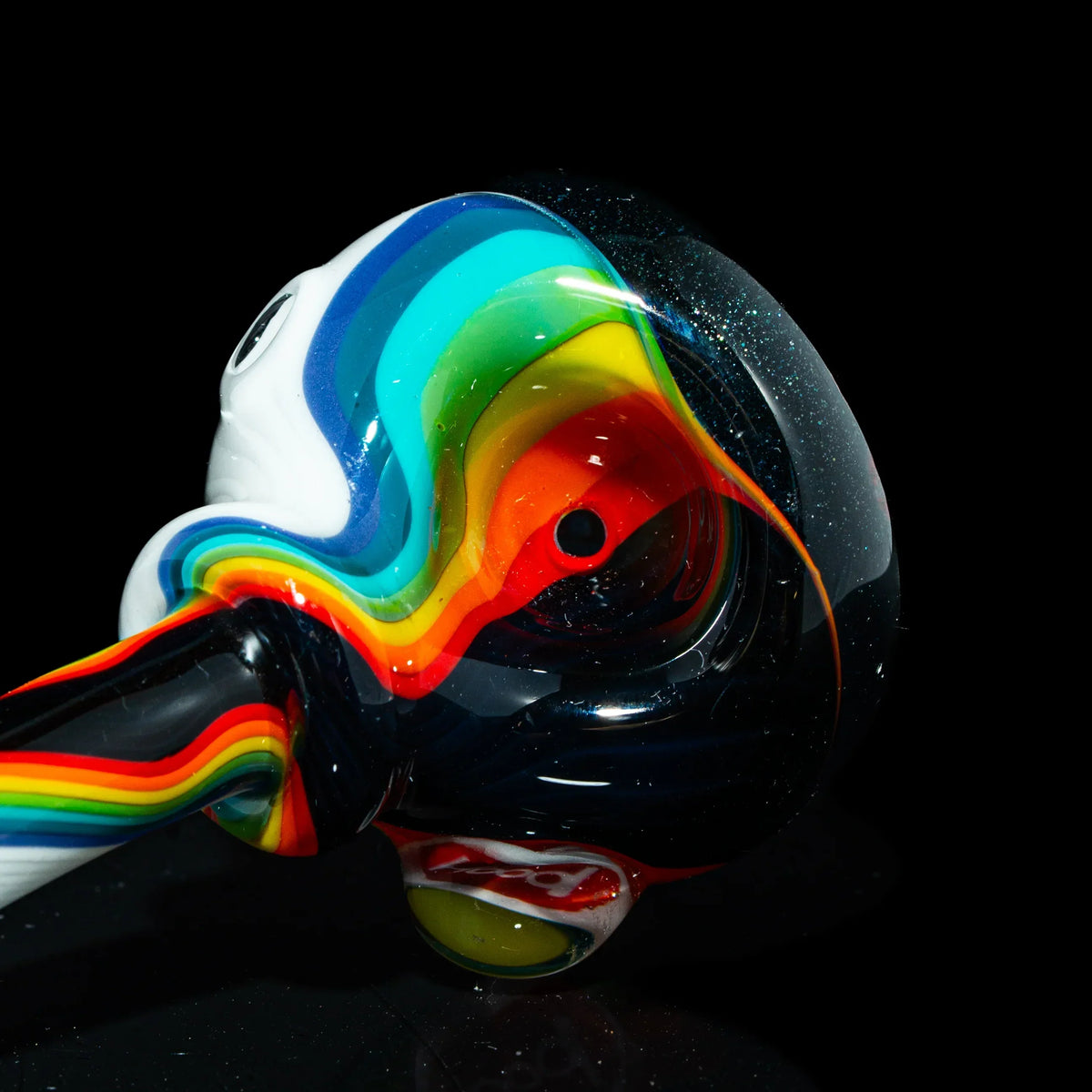 Hand-blown glass pipe with vibrant rainbow linework on a glossy black background
