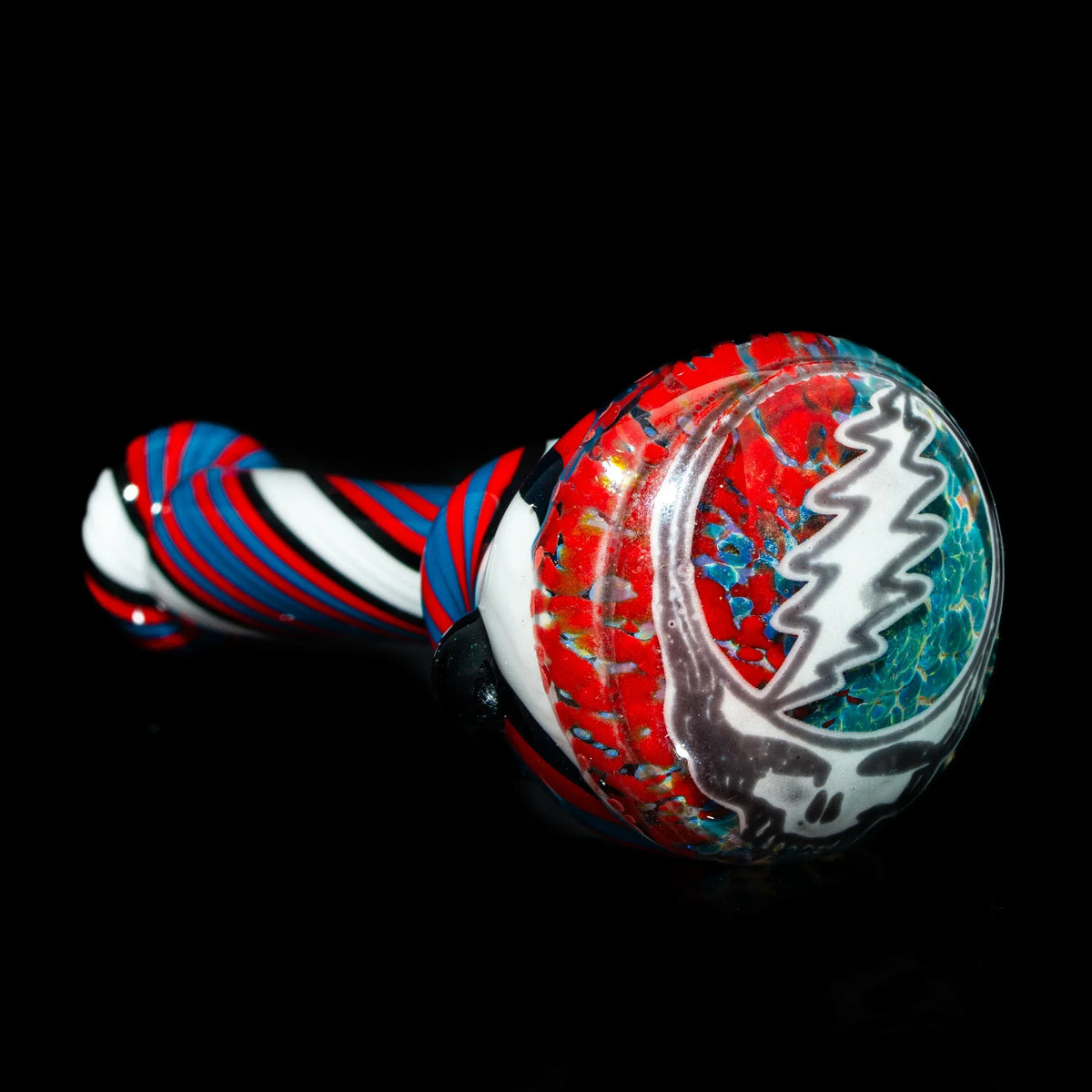 Red, white, and blue glass spoon pipe with Grateful Dead Steal Your Face design