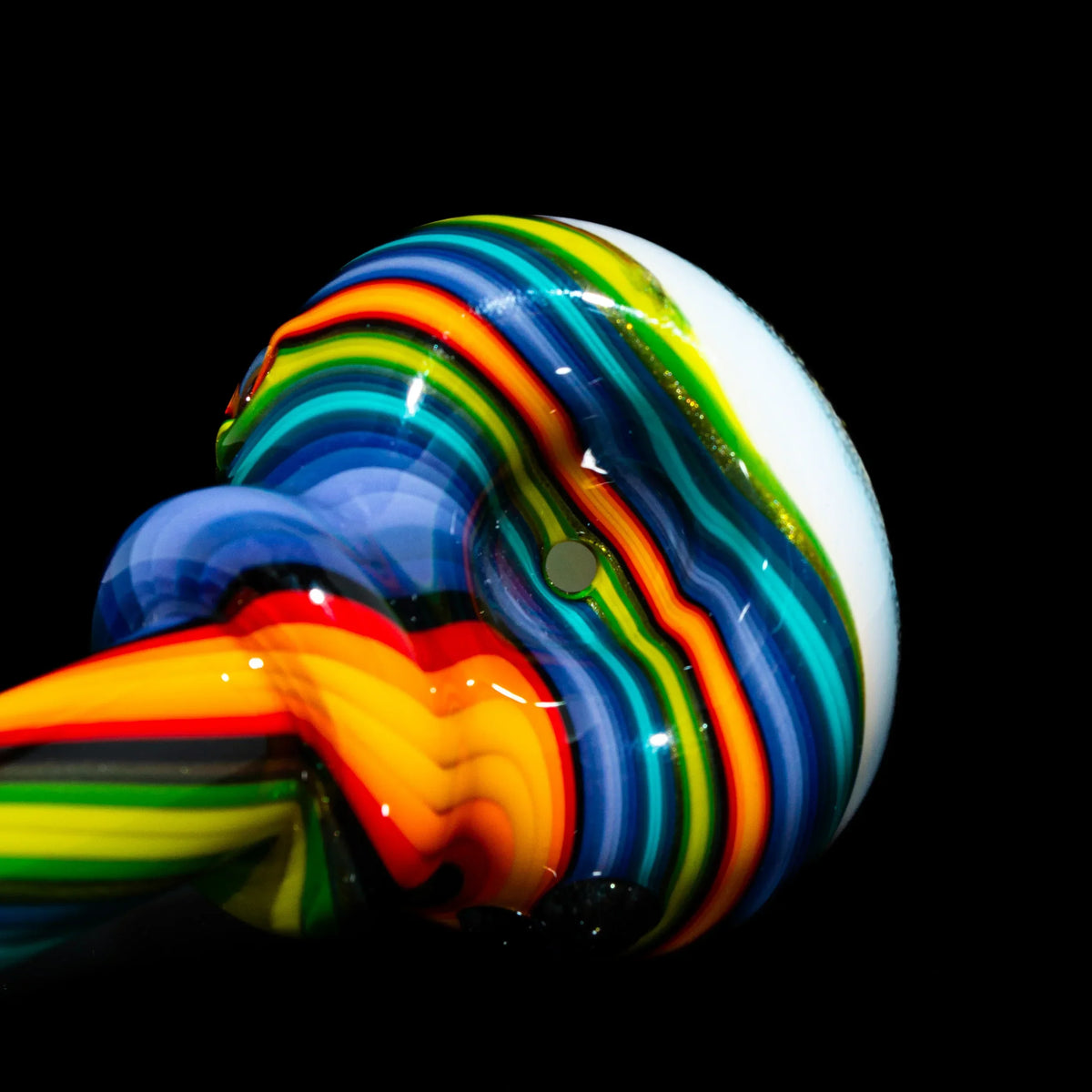 Colorful rainbow linework glass spoon pipe with intricate patterns on a black background.