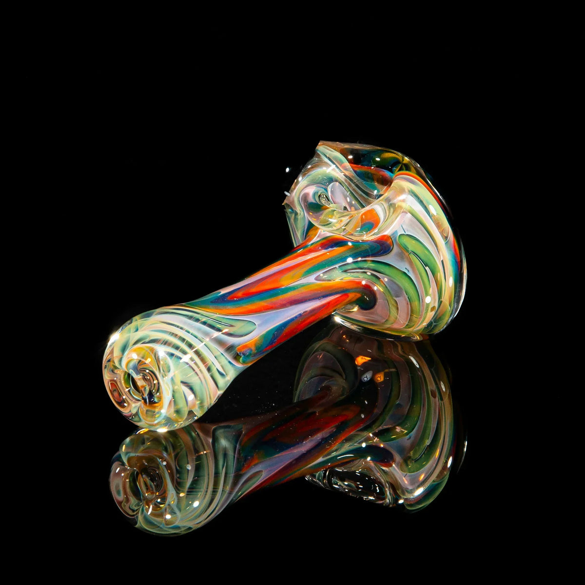 Colorful glass hand pipe with blue, green, and yellow swirls on a black background