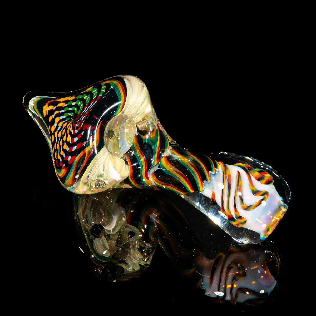 Colorful reticello Sherlock glass pipe with green, yellow, and brown patterns on black background.