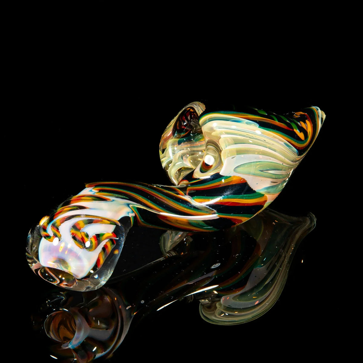 Handcrafted glass sherlock pipe with green, yellow, and brown reticello pattern on black background
