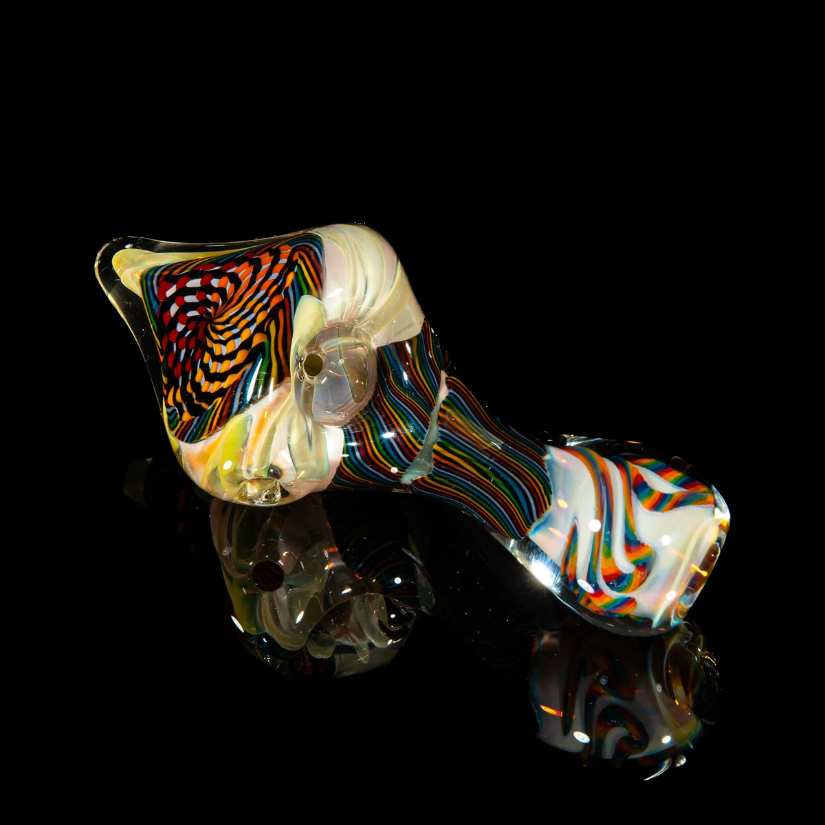 Colorful reticello sherlock glass pipe with orange, brown, and yellow patterns on black background.
