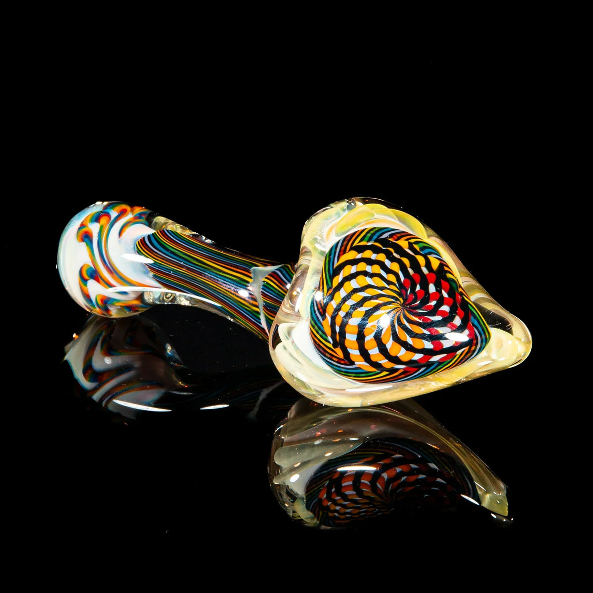 Colorful reticello glass sherlock hand pipe with orange, brown, and yellow swirls on black background