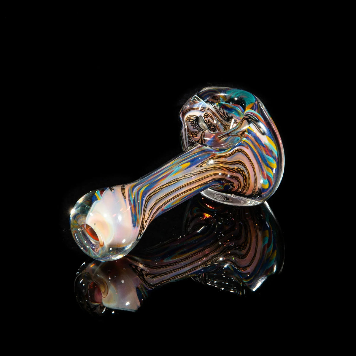 Handblown glass pipe with swirling yellow, teal, and purple accents on a black background